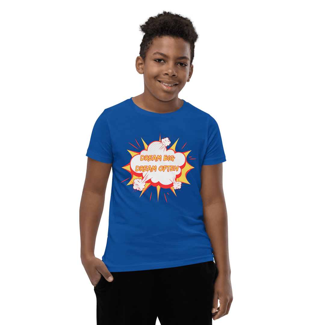 Young Black Boy smiling wearing Blue Motivational children’s T-shirt connecting to the Dream Big Coloring Book; representation and confidence for future professionals
