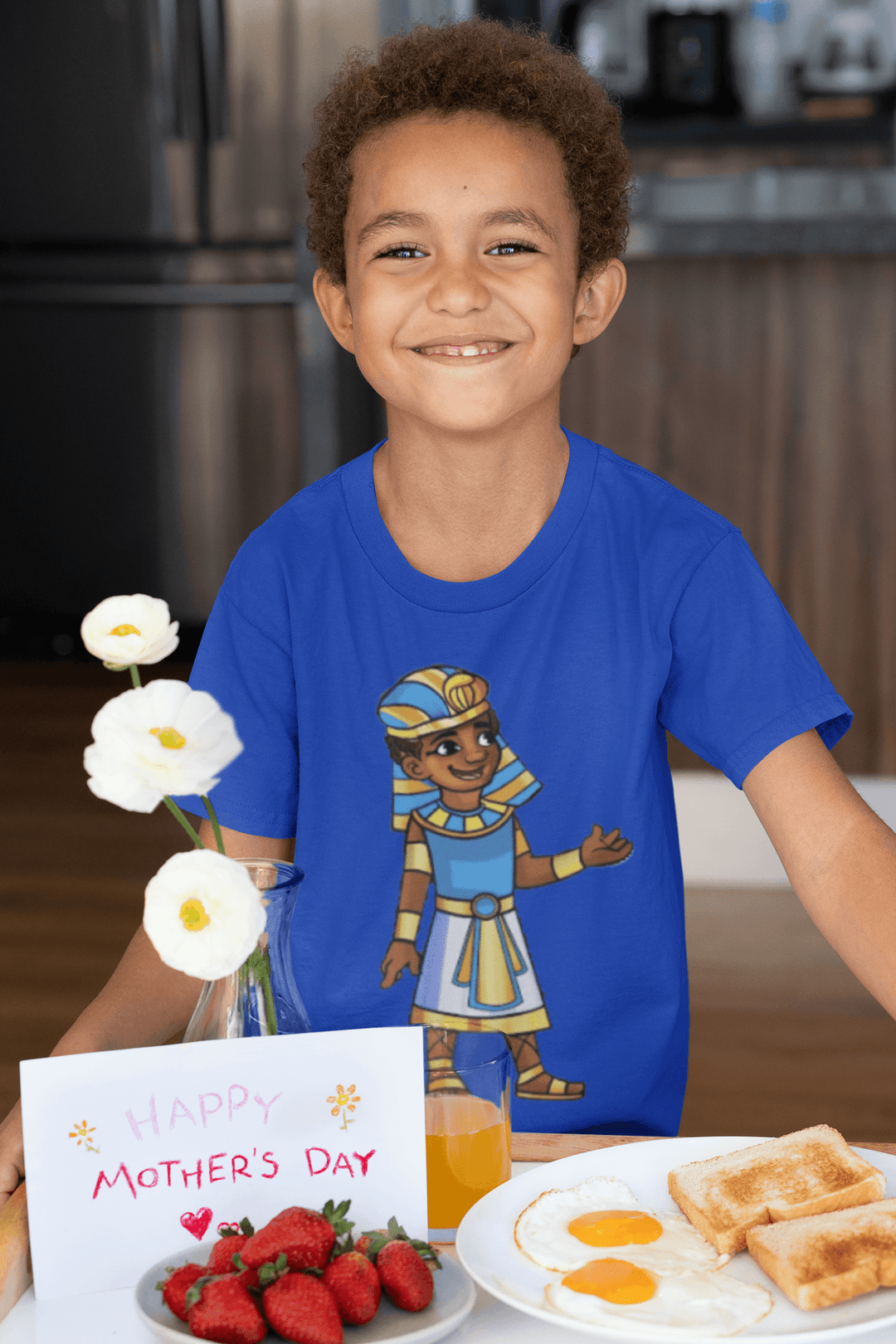 Tut T-shirt featuring a gold crown and displaying friendship; cultural empowerment apparel for young leaders. On Mother's Day